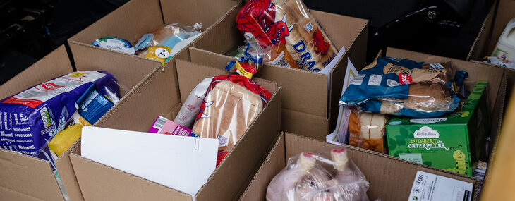 A selection of food is pictured in boxes ready to be distributed from a food bank. Estatea agents