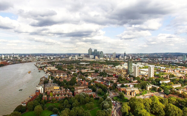 Ariel view of London and the South East with Canary Wharf pictured on the skyline on an Autumn day.