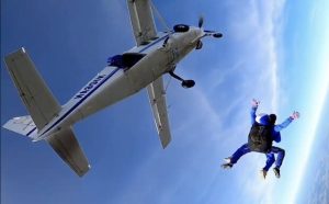 Ben Gee is pictured tamed skydiving from a plane above the UK.
