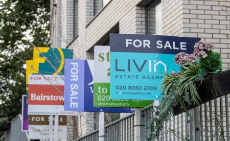 For sale boards pictured in Croydon, London, in July 2023.