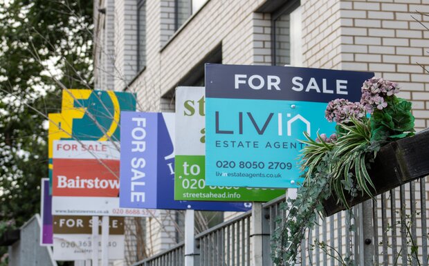 For sale boards pictured in Croydon, London, in July 2023.