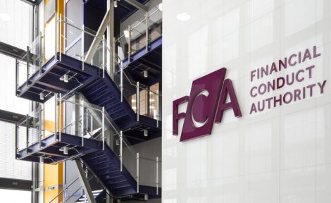 A picture of the Financial Conduct Authority logo taken from inside its reception in Stratford, London.