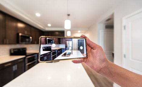 Agent videoing a kitchen