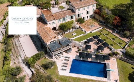 aerial view of country property and pool Chartwell Noble logo