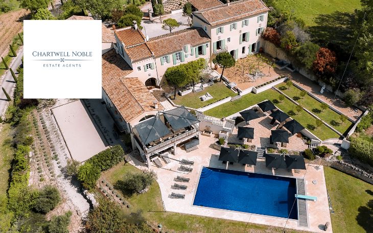 aerial view of country property and pool Chartwell Noble logo