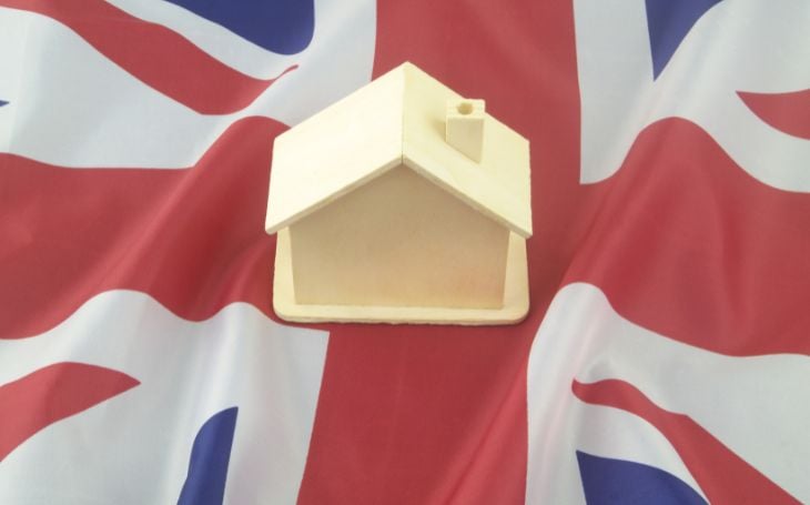 UK flag with house model on