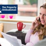 the property ombudsman logo woman making complaint on phone