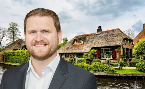Ryan Etchells and a thatched cottage by water