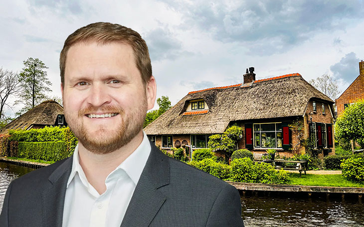 Ryan Etchells and a thatched cottage by water