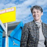 summer distractions house price article - beach hut for sale sign and kate faulkner