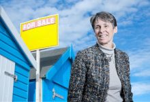 summer distractions house price article - beach hut for sale sign and kate faulkner
