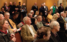 bidders in auction room